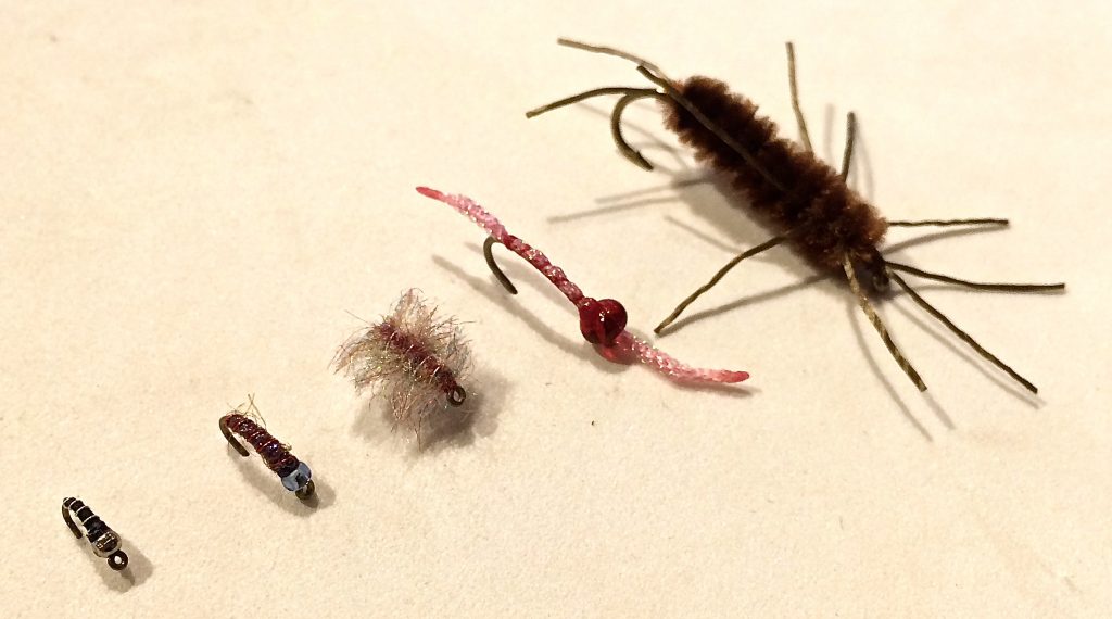 L to R: Zebra Midge, Grape Slushy, Tailwater Sow Bug, Jemstoner Worm, Pat's Rubber Leg Stone.